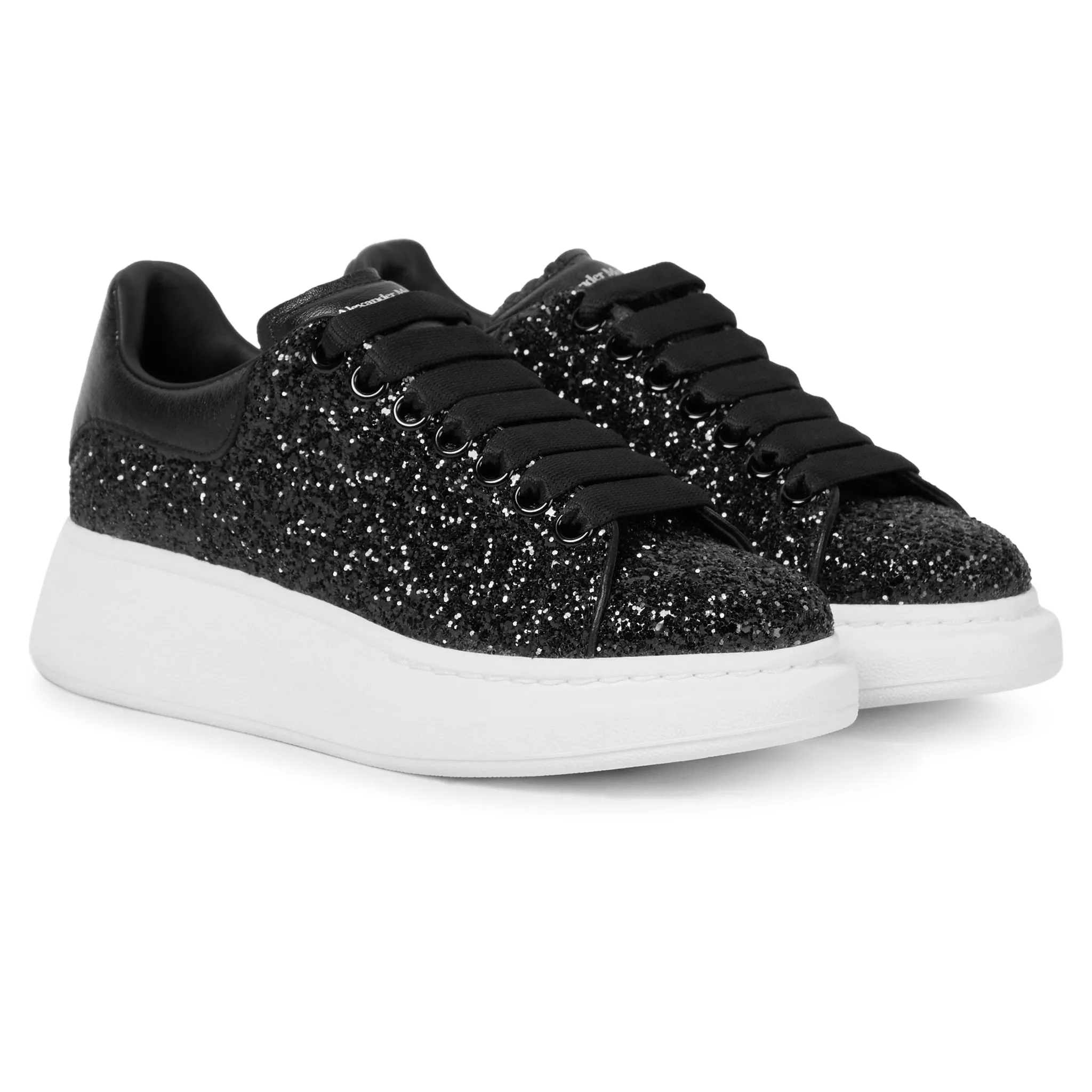 Alexander Mcqueen black glitter trainers with raised sole.