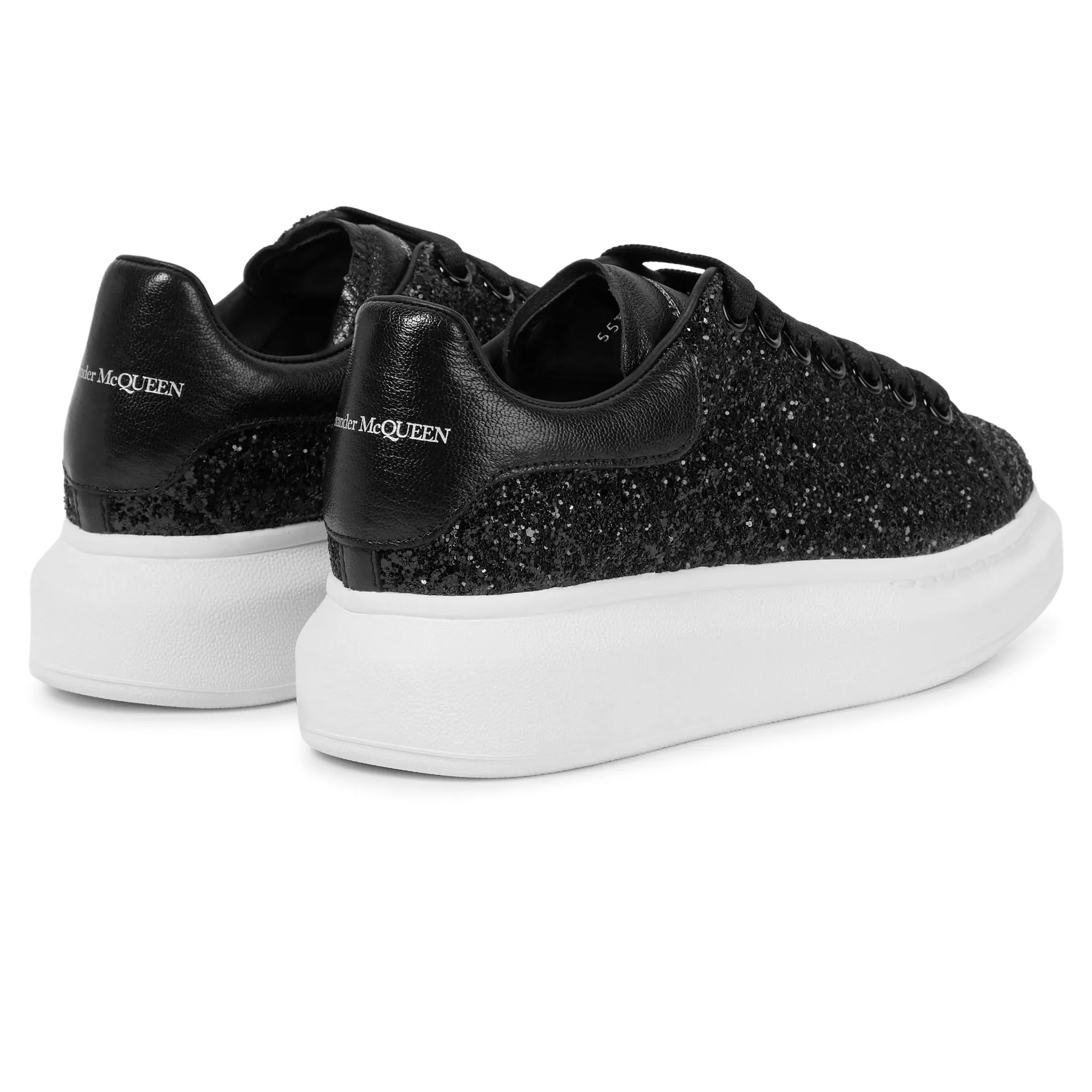 Alexander Mcqueen black glitter trainers with raised sole.